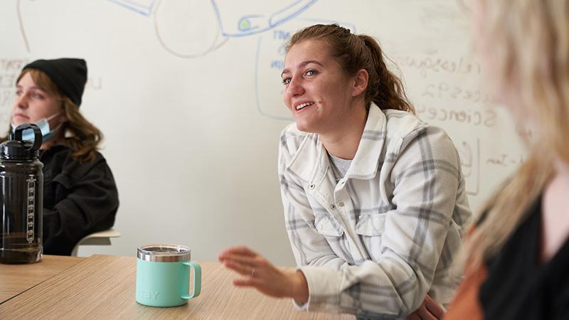 Girl in meeting with coffee